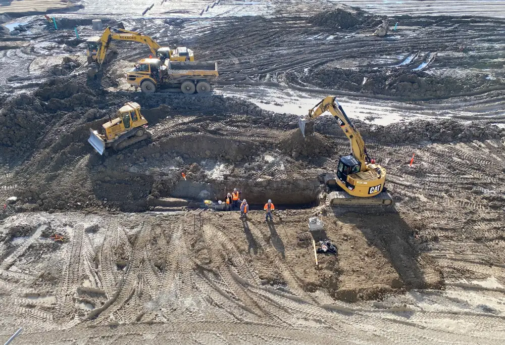 Heavy equipment performing earthworks on site
